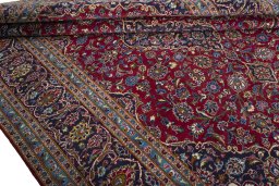 Close-up detail of 2000s Kashan rug from Iran / Persia showing Wool weave