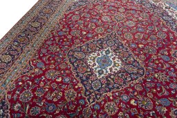 Backside of handmade 2000s Kashan rug showing knot structure and weave density