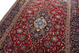 Backside of handmade 2000s Kashan rug showing knot structure and weave density