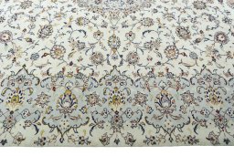 Corner detail of 2000s Kashan rug showing border pattern and Wool pile