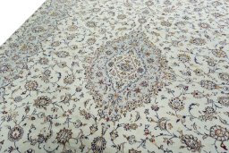 Backside of handmade 2000s Kashan rug showing knot structure and weave density