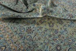 Surface texture of 2000s Kashan rug with natural Wool and intricate pattern