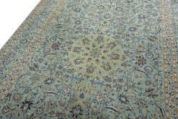 Backside of handmade 2000s Kashan rug showing knot structure and weave density