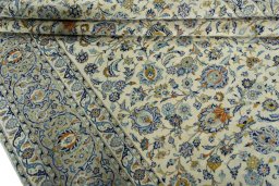Close-up detail of 2000s Kashan rug from Iran / Persia showing Wool weave