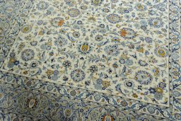Close-up detail of 2000s Kashan rug from Iran / Persia showing Wool weave