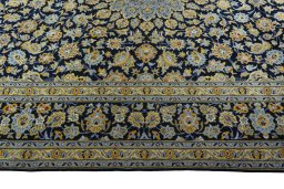 Corner detail of 2000s Kashan rug showing border pattern and Wool pile