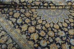 Close-up detail of 2000s Kashan rug from Iran / Persia showing Wool weave