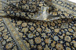 Surface texture of 2000s Kashan rug with natural Wool and intricate pattern