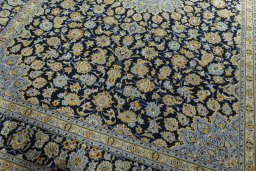 Close-up detail of 2000s Kashan rug from Iran / Persia showing Wool weave