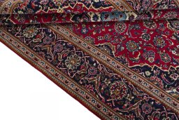 Close-up detail of 2000s Kashan rug from Iran / Persia showing Wool weave