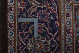 Central medallion detail of 2000s Kashan rug from Iran / Persia