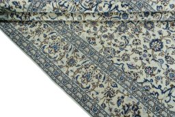 Close-up detail of 2000s Kashan rug from Iran / Persia showing Wool weave