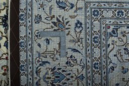 Central medallion detail of 2000s Kashan rug from Iran / Persia