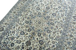 Backside of handmade 2000s Kashan rug showing knot structure and weave density
