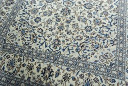 Close-up detail of 2000s Kashan rug from Iran / Persia showing Wool weave