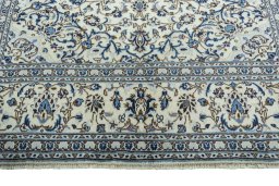 Full view of 2000s Kashan rug from Iran / Persia, 302 × 196 cm in Beige tones