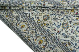 Close-up detail of 2000s Kashan rug from Iran / Persia showing Wool weave