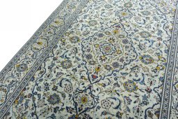 Backside of handmade 2000s Kashan rug showing knot structure and weave density