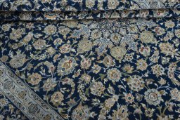 Close-up detail of 2000s Kashan rug from Iran / Persia showing Wool weave