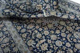 Surface texture of 2000s Kashan rug with natural Wool and intricate pattern