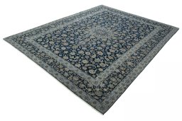 Corner detail of 2000s Kashan rug showing border pattern and Wool pile
