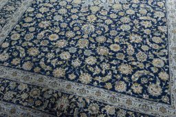 Close-up detail of 2000s Kashan rug from Iran / Persia showing Wool weave