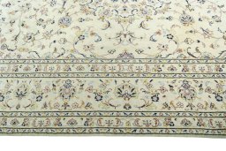 Corner detail of New Kashan rug showing border pattern and Wool pile