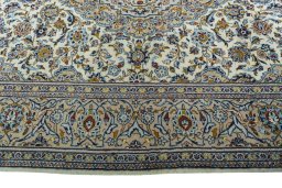 Corner detail of 2000s Kashan rug showing border pattern and Wool pile