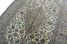 Backside of handmade 2000s Kashan rug showing knot structure and weave density