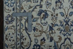 Surface texture of 2000s Kashan rug with natural Wool and intricate pattern