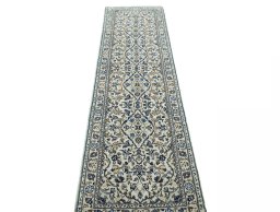 Surface texture of 2000s Kashan rug with natural Wool and intricate pattern