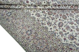 Close-up detail of 2000s Kashan rug from Iran / Persia showing Wool weave