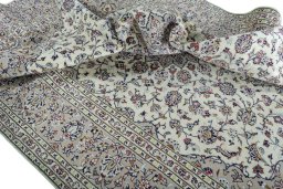Surface texture of 2000s Kashan rug with natural Wool and intricate pattern