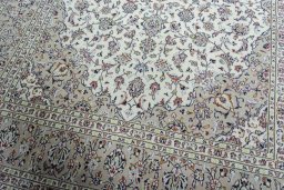 Close-up detail of 2000s Kashan rug from Iran / Persia showing Wool weave