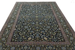 Surface texture of 2000s Kashan rug with natural Wool and intricate pattern