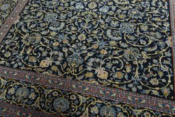 Close-up detail of 2000s Kashan rug from Iran / Persia showing Wool weave