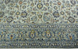 Corner detail of 1970s Kashan rug showing border pattern and Wool pile