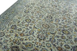 Backside of handmade 1970s Kashan rug showing knot structure and weave density