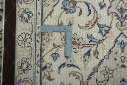 Surface texture of 2000s Kashan rug with natural Wool and intricate pattern