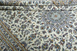 Close-up detail of 2000s Kashan rug from Iran / Persia showing Wool weave