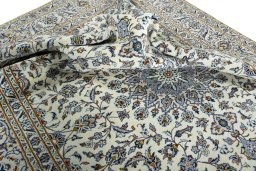 Surface texture of 2000s Kashan rug with natural Wool and intricate pattern