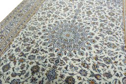 Backside of handmade 2000s Kashan rug showing knot structure and weave density