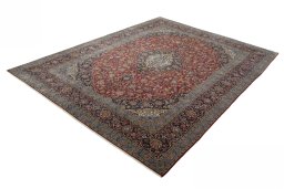 Corner detail of 2000s Kashan rug showing border pattern and Cork pile