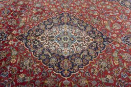 Central medallion detail of 2000s Kashan rug from Iran / Persia