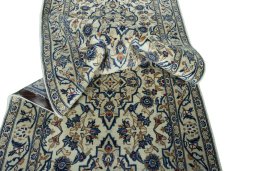 Close-up detail of 2000s Kashan rug from Iran / Persia showing Wool weave