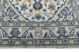 Close-up detail of 2000s Kashan rug from Iran / Persia showing Wool weave