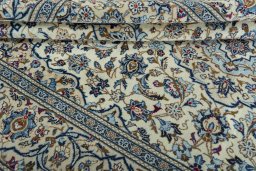 Close-up detail of 2000s Kashan rug from Iran / Persia showing Wool weave