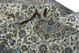 Surface texture of 2000s Kashan rug with natural Wool and intricate pattern