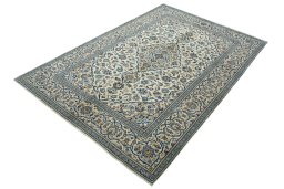 Corner detail of 2000s Kashan rug showing border pattern and Wool pile