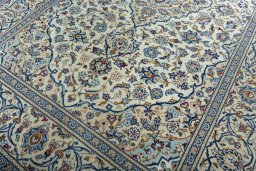Close-up detail of 2000s Kashan rug from Iran / Persia showing Wool weave